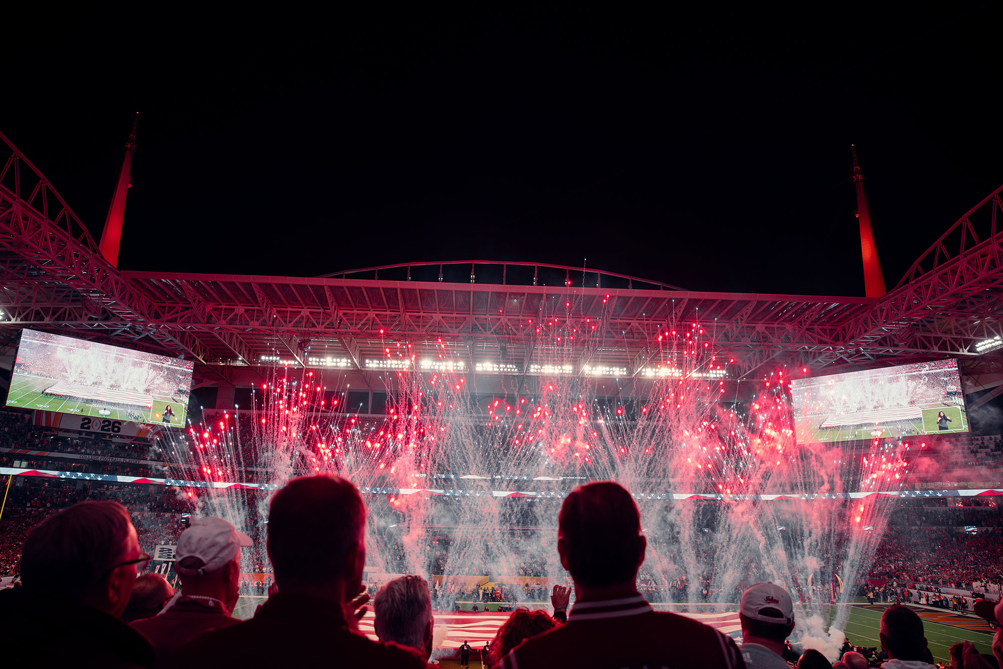 Fireworks over the field during National Championship pregame, seen from the stands