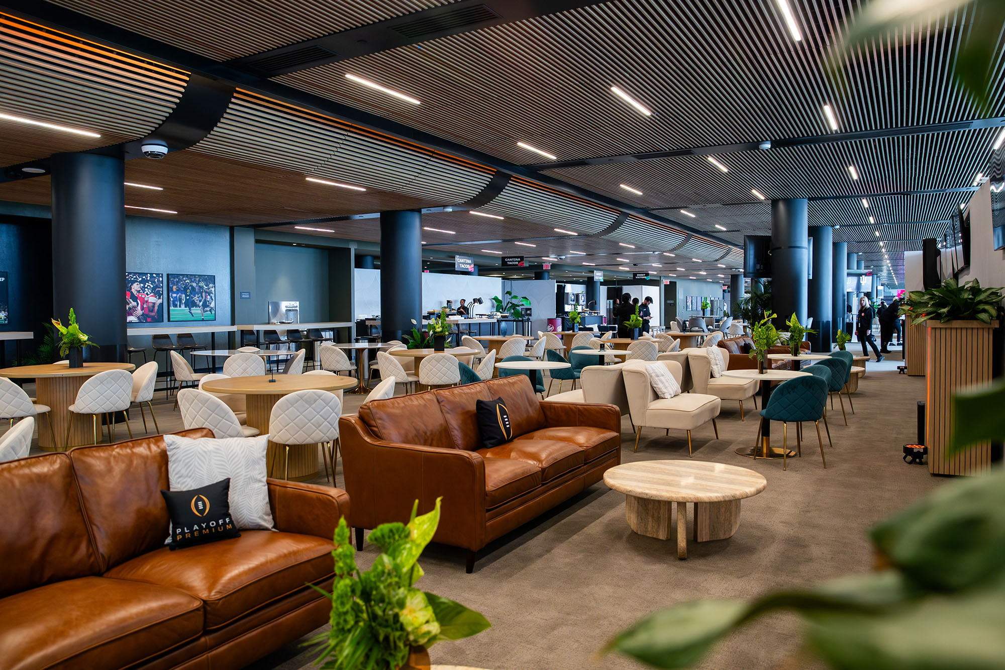 The Playoff Premium hospitality lounge set with lounge seating and dining tables